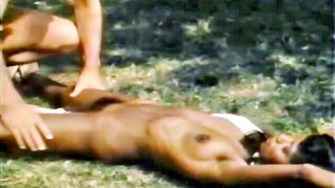 Vintage ebony nude woman touched by man outdoors in hardcore Tabu Film