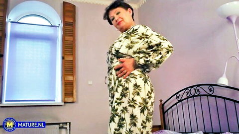 Mature Nata in floral kimono dress, teasing pose solo