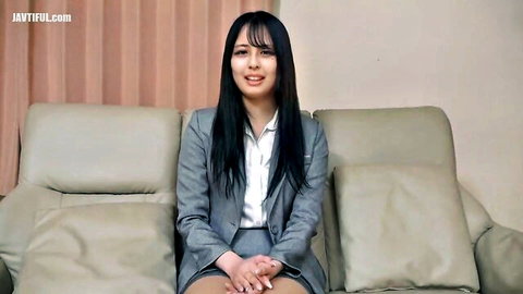 Asian JAV office lady in gray suit smiling seductively for job offer