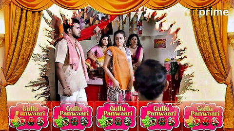 Group of clothed Indian housewives and men in traditional attire posing in Gulli Panwari TV scene