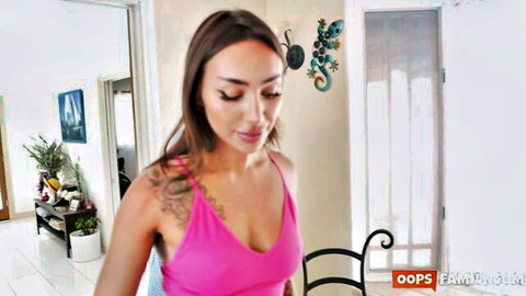 Sisi Rose in low-cut pink tank top, teasing cleavage in Oops Family scene