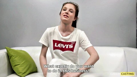 Czech casting amateur babe in tight Levi's shirt sits on couch for interview