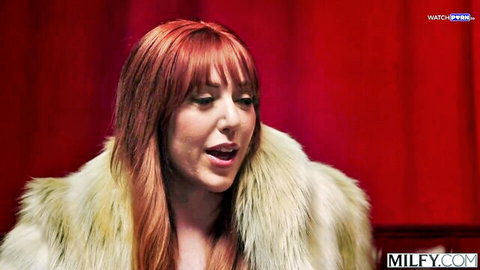Curvy redhead MILF Lauren Phillips in fur coat, seductive expression