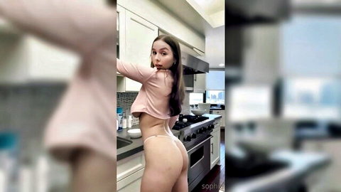 Sophie Mudd teasing in pink crop top and white thong, big ass view