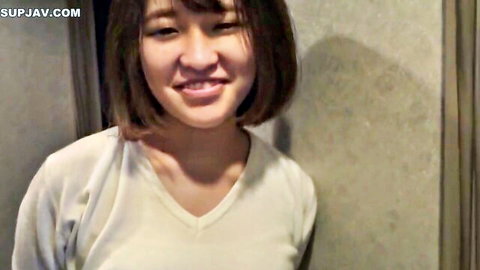 Smiling young Asian woman in white V-neck top, JAV amateur thumbnail