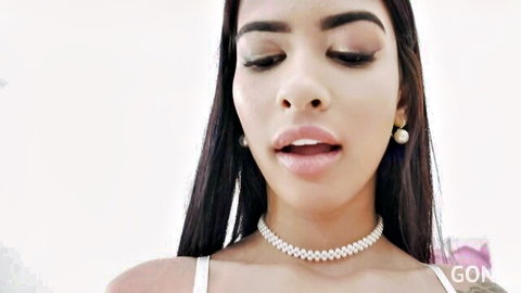 Veronica Leal seductive close-up, plump lips and pearl necklace
