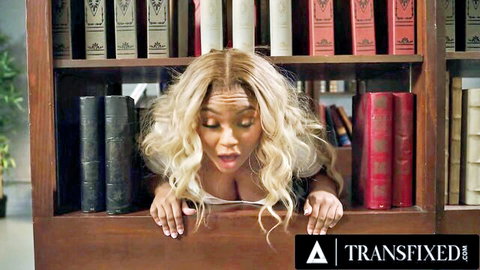 Blonde trans babe with huge cleavage peeking surprised through library bookshelves