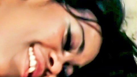 Ebony woman smiling widely with teeth and glossy lips in vintage porn close-up