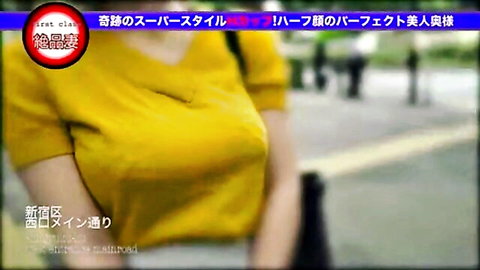 Busty Asian woman in tight yellow V-neck top showing massive cleavage outdoors