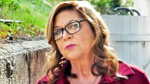 Mature blonde granny in glasses and red blouse, exciting tease
