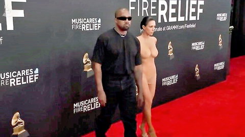 Kanye West and Bianca Censori at Grammy 2025, her in sheer nude outfit on red carpet