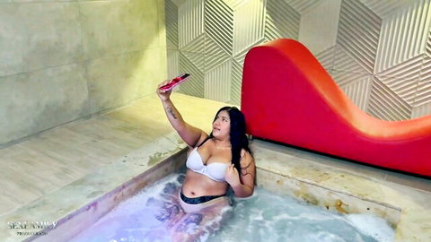 Curvy Indian stepsister teases in jacuzzi with white bra and tattoos
