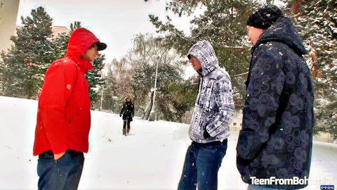 Three young men in winter jackets chatting in snowy outdoor setting, TeenFromBohemia group tease