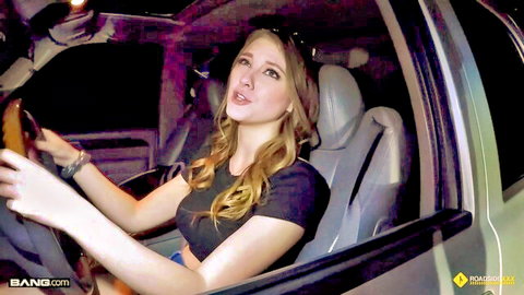 Blonde Melody Marks driving car at night, teasing in crop top and shorts