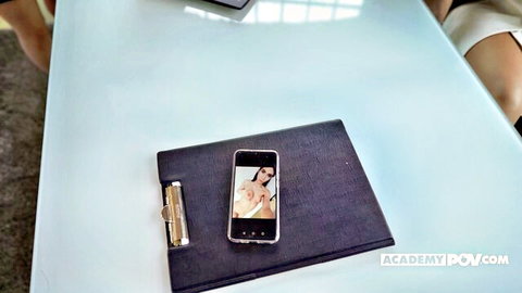 Tina Kay in seductive office pose with explicit phone preview, anal POV tease
