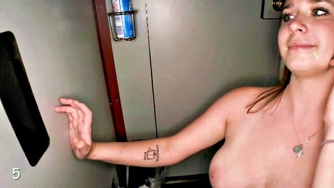 Topless amateur slut with tattoo smiles at gloryhole ready for blowjob