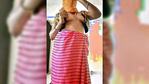Topless Indian woman exposes big natural tits and dark nipples in pink striped saree homemade tease