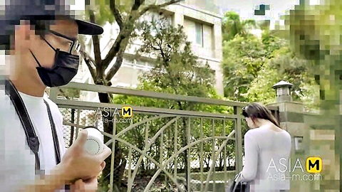 Masked Asian voyeur films sexy woman's big ass from behind outdoors