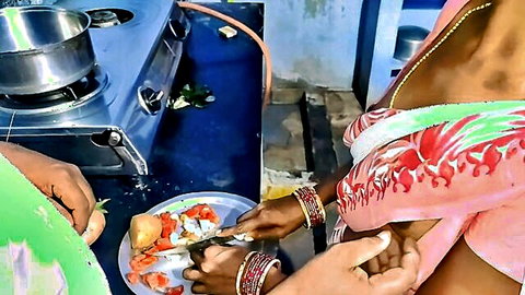YourAnitha Indian village wife in green saree cooking in kitchen