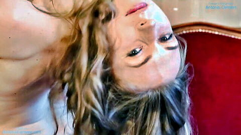 Annett A flexible naked dancer spreads legs wide in erotic pose