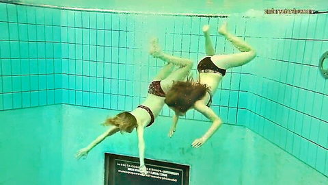 Libuse and Nastya in sexy underwater bikini play in pool