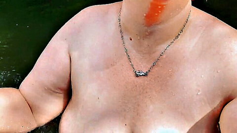 Busty BBW bathing beauty with large bouncy tits in water