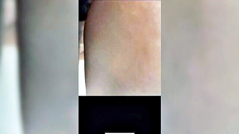 Mystery woman bending over, teasing with round pale ass in dim light