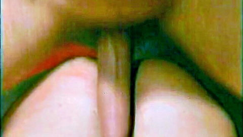 Close-up of wet shaved pussy penetrated by thick dildo, spread legs