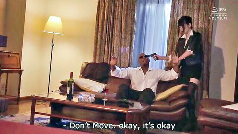 Japanese woman in black dress holds black man at gunpoint in tense JAV interracial scene