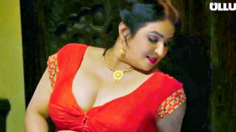 Desi Indian babe in red low-cut blouse, deep cleavage, Ullu hot web series scene