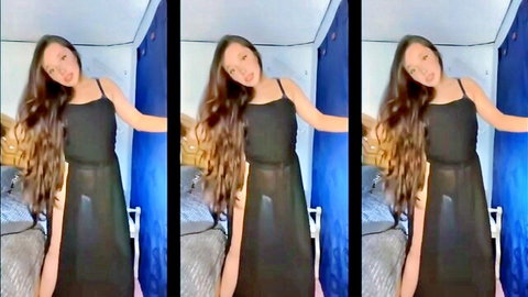 Asian woman in sheer black transparent dress posing seductively, long hair