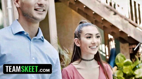 Bailey Base smiles flirtatiously at landlord in pink top and choker
