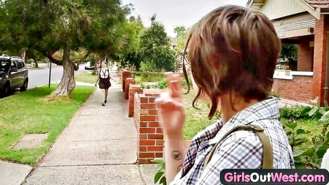 Australian amateur woman in checkered shirt gesturing on suburban street