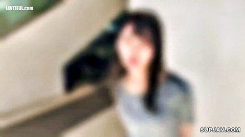 Blurry smiling Asian girl with long dark hair in car, amateur JAV preview