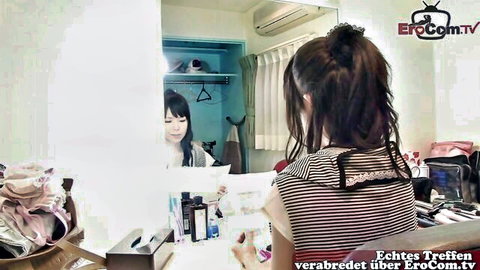 Petite Asian teen with ponytail at mirror in hotel room getting ready to fuck