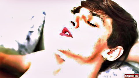 Gay submissive twink with eyes closed in ecstasy, lips parted moaning on pillows