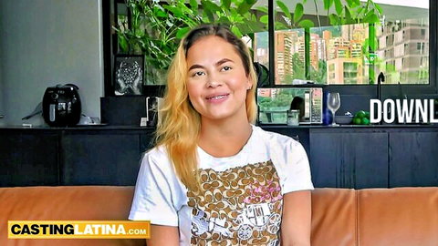 Cute smiling Latina with blonde hair in casual casting interview