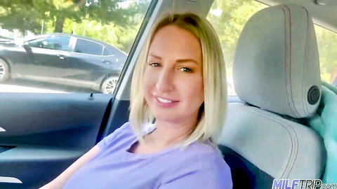 Blonde Quinn Waters smiling in car, ready for stranger hookup