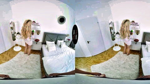 Curvy blonde MILF in white lingerie teases ass standing by bed in POV VR