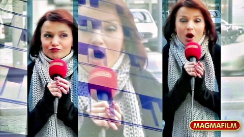 Attractive redhead reporter in stockings teases gangbang action
