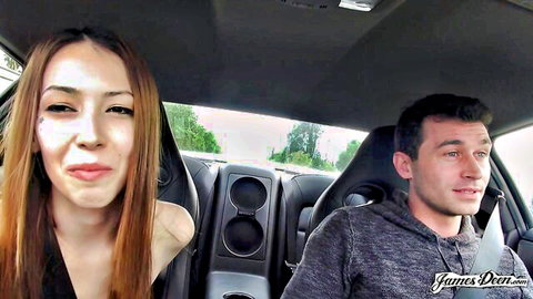 Skinny Asian teen with long hair puckers lips for blowjob tease in sports car passenger seat
