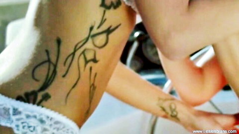 Eastern European lesbians in sexy lingerie with intricate tattoos