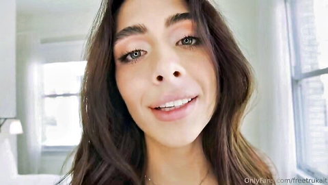 Tru Kait smiling seductively in close-up for massive facial VR scene
