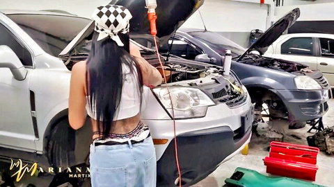 Mariana Martix as sexy Latina mechanic bends over car in tight jeans and white top