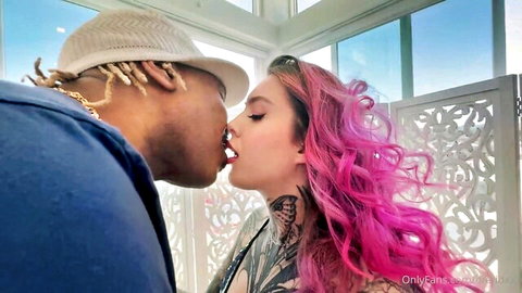 Pandora Skye passionately kissed by partner, pink hair and tattoos