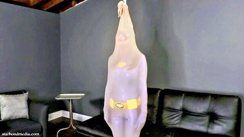 Chrissy Marie as Batgirl in transparent latex encasement suit, superhero fetish