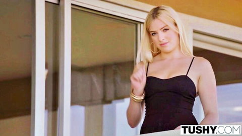 Stunning blonde in low-cut black top posing seductively for Tushy platinum compilation