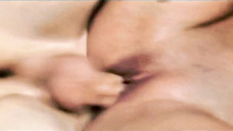 Close-up of shaved MILF pussy creampied with cum leaking as cock withdraws.