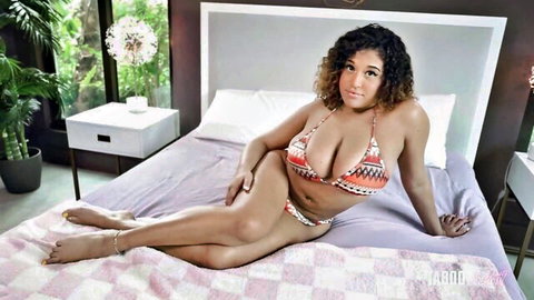 Funsized Megan in revealing tribal bikini, curvy tease pose