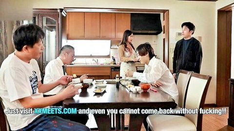 Asian stepmom in apron serves dinner to stepson and husband in taboo family scene